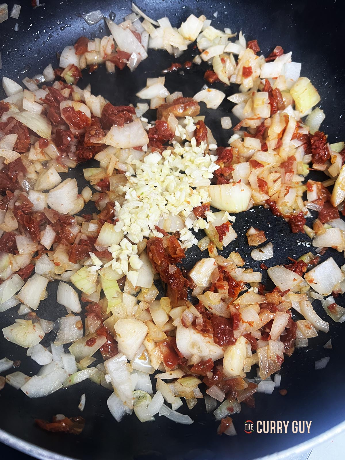 garlic added to pan. 