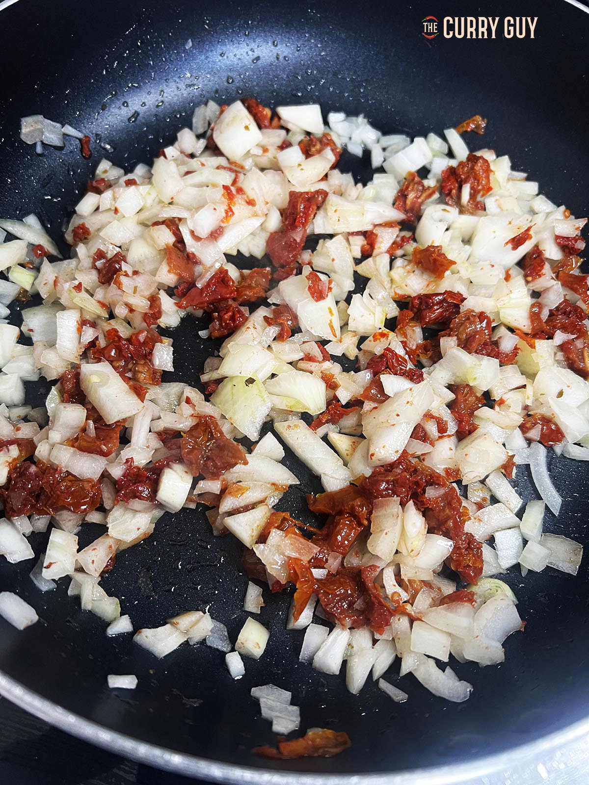 onions and tomatoes frying 