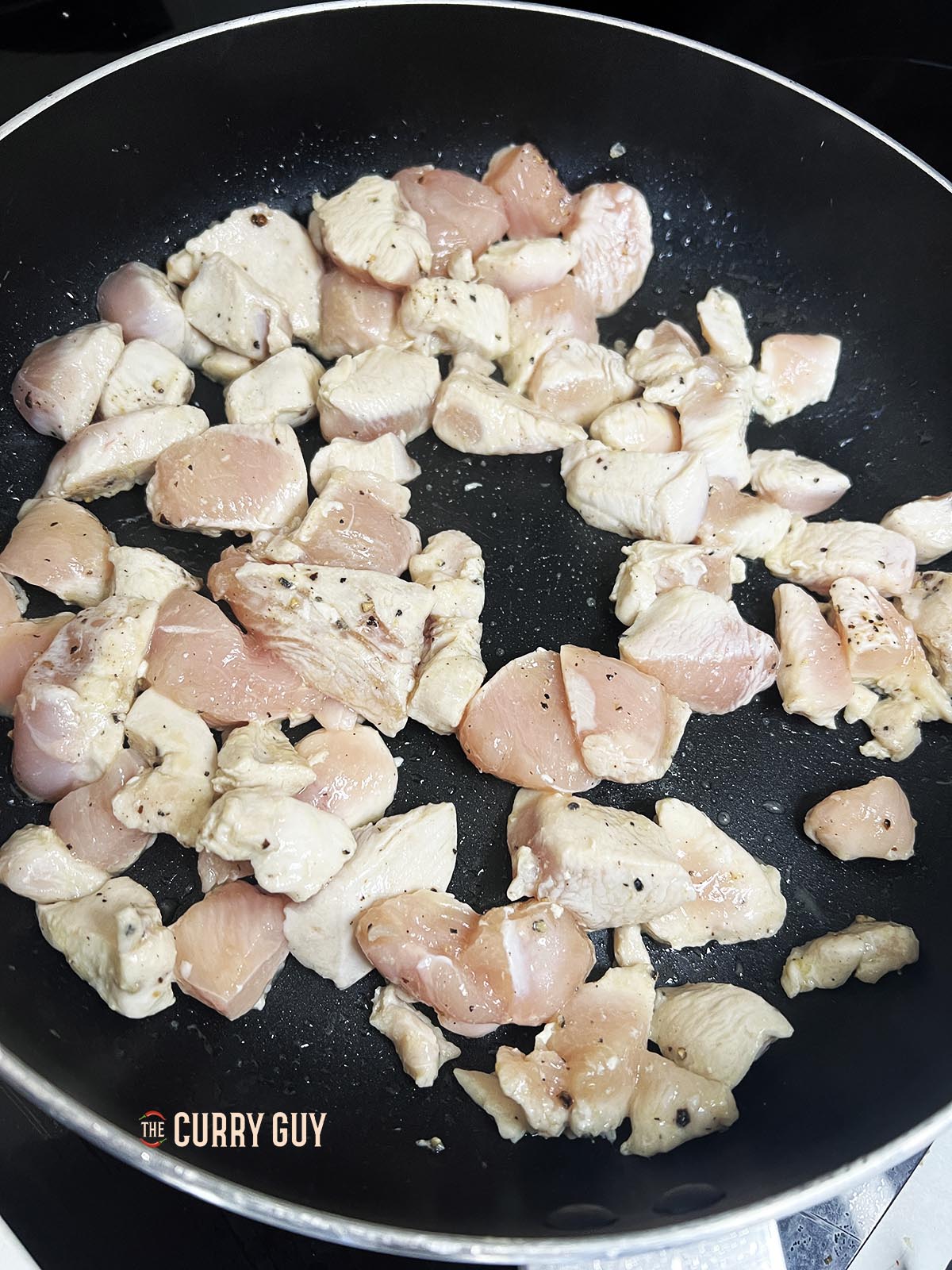 Chicken frying in pan
