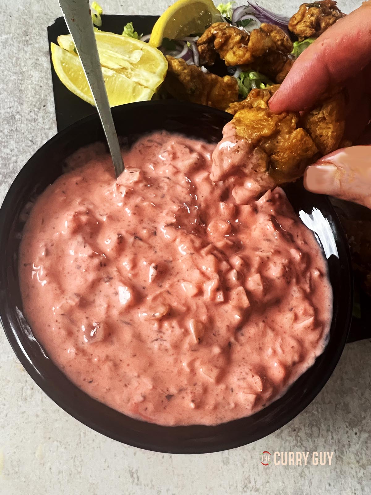 Pakora sauce photographed with chicken pakoras.