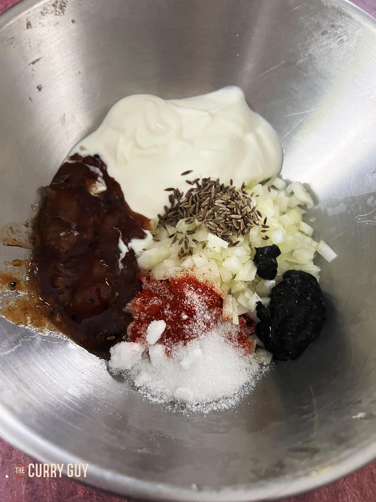 All of the ingredients in a mixing bowl. 