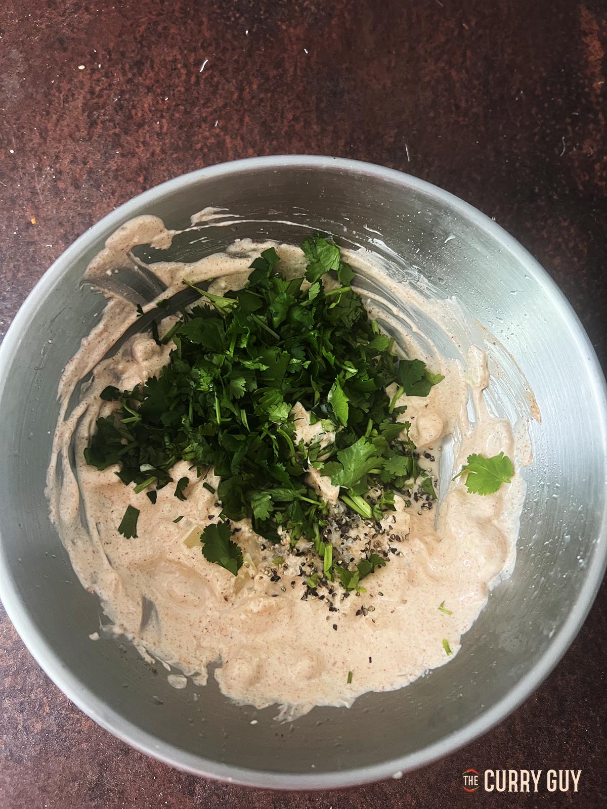 Adding coriander (cilantro) salt and lime juice to finish.