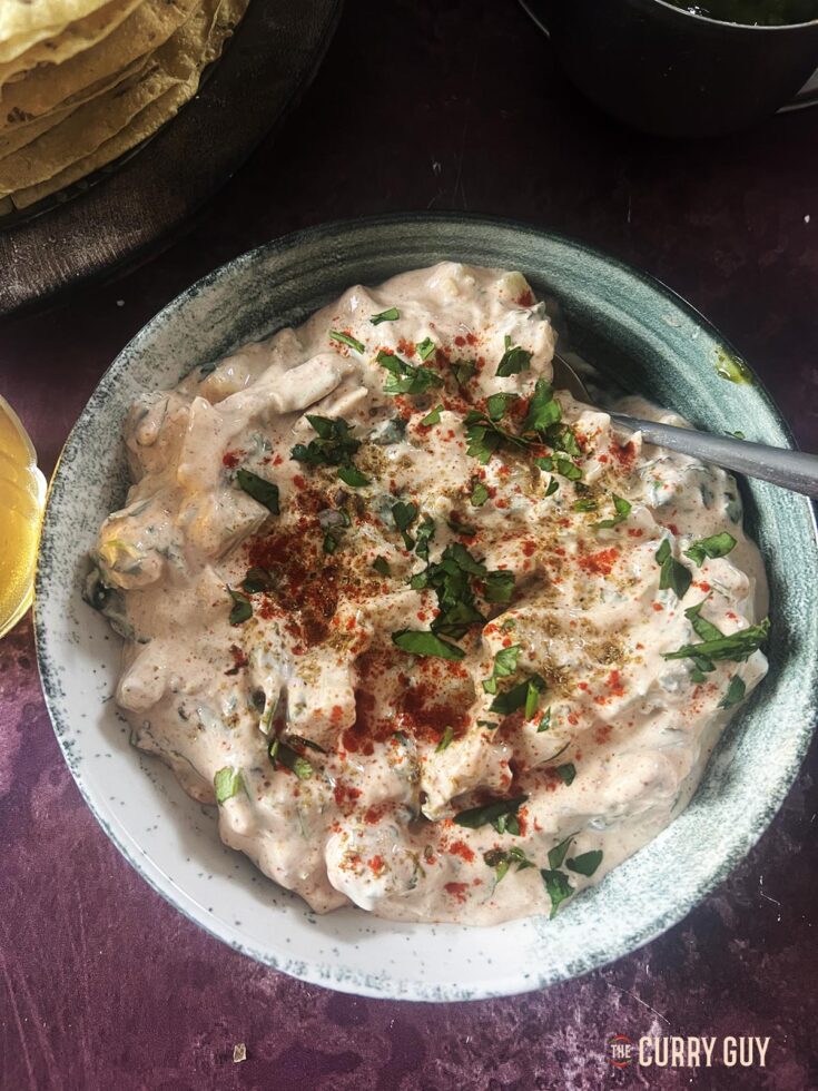 Potato raita in a serving bowl.