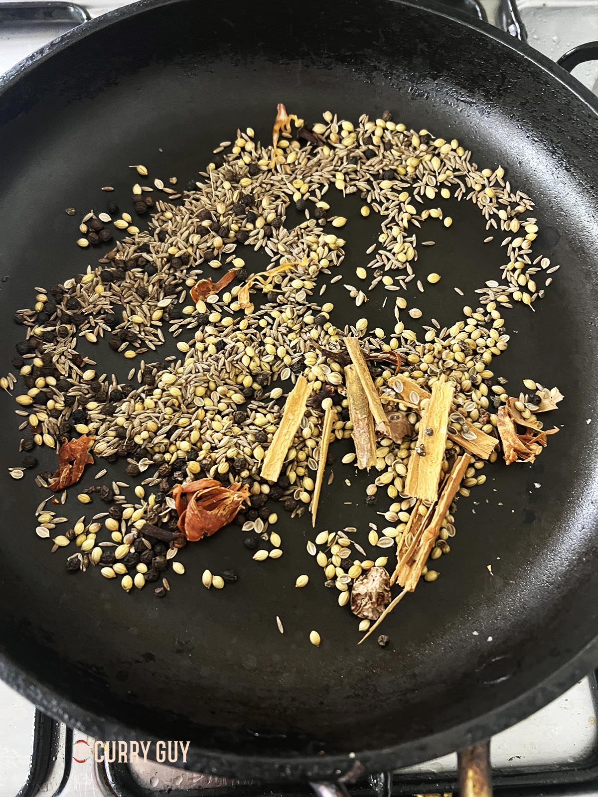 Toasting the whole spices.