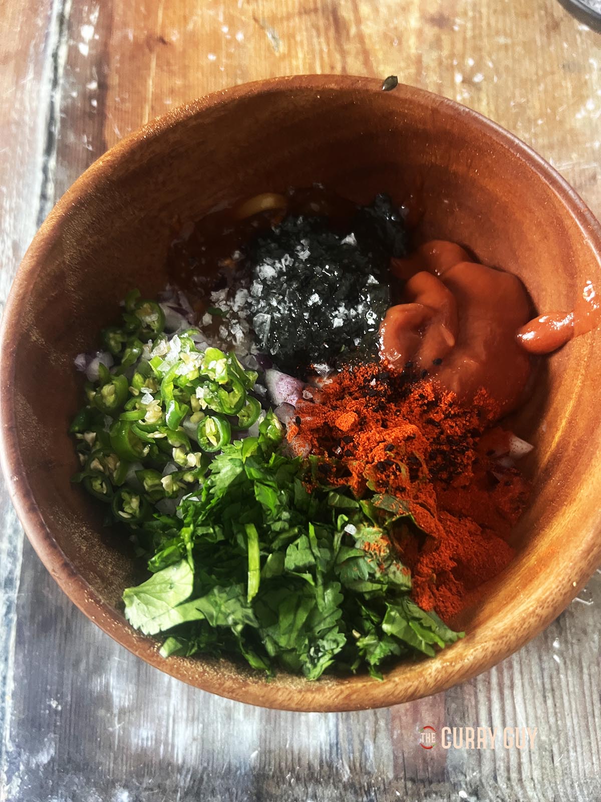 All of the ingredients except for the food colouring and lemon juice in a mixing bowl.