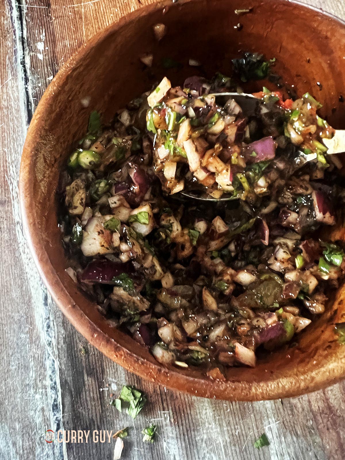 Stirring the chutney to combine the ingredients.