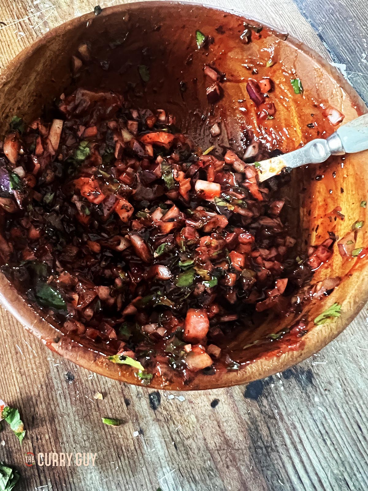 Stirring the food colouring into the chutney.