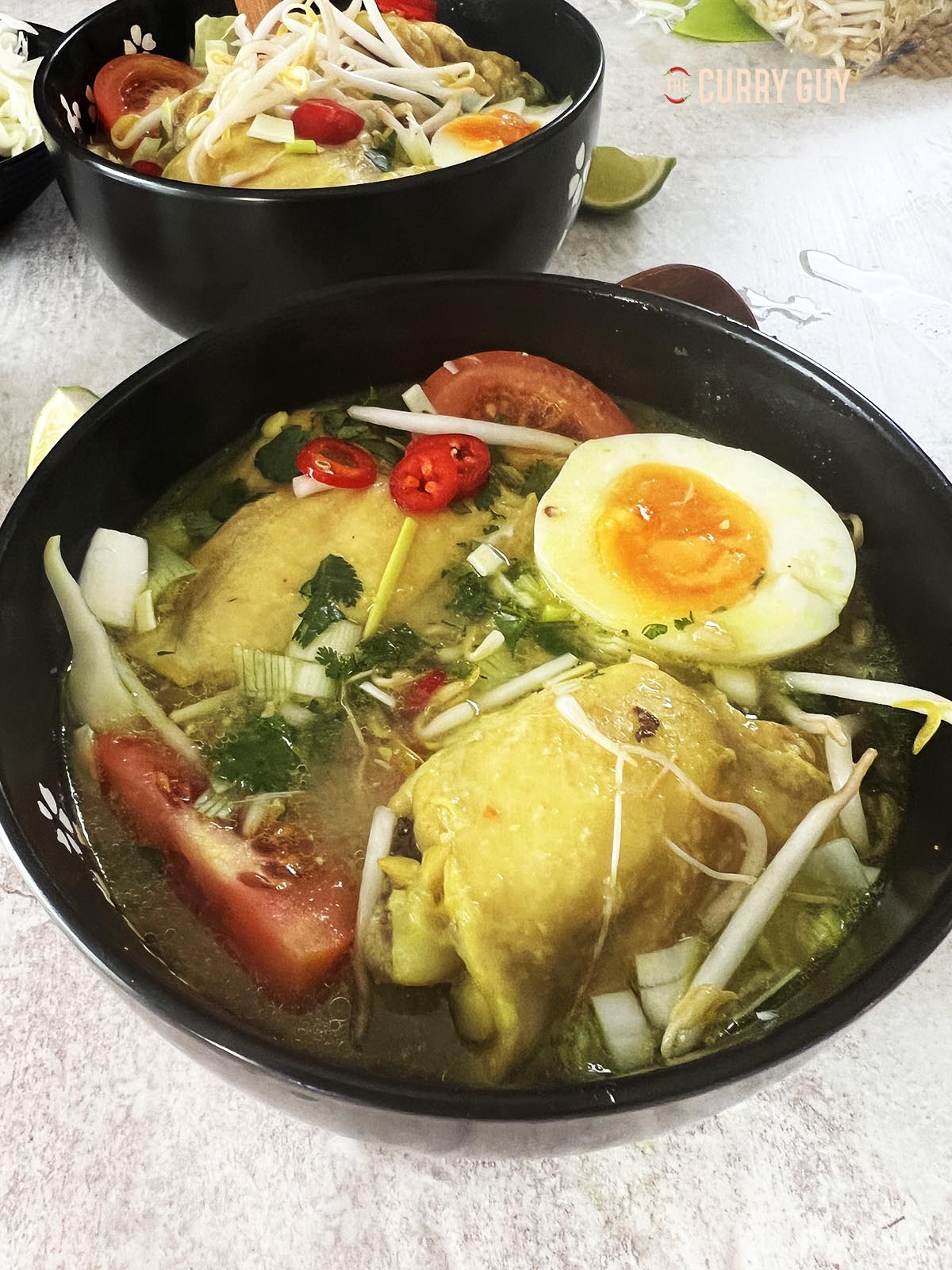 soto ayam in a serving bowl.