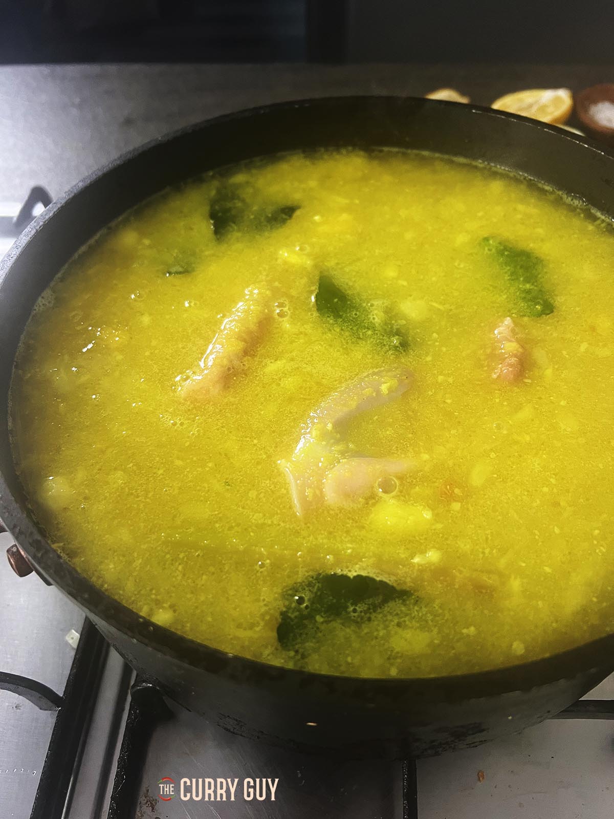 Adding the chicken to the stock.