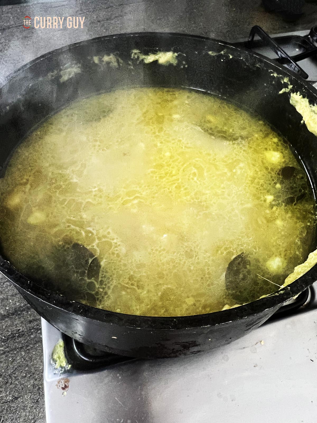 Simmering the stock further.