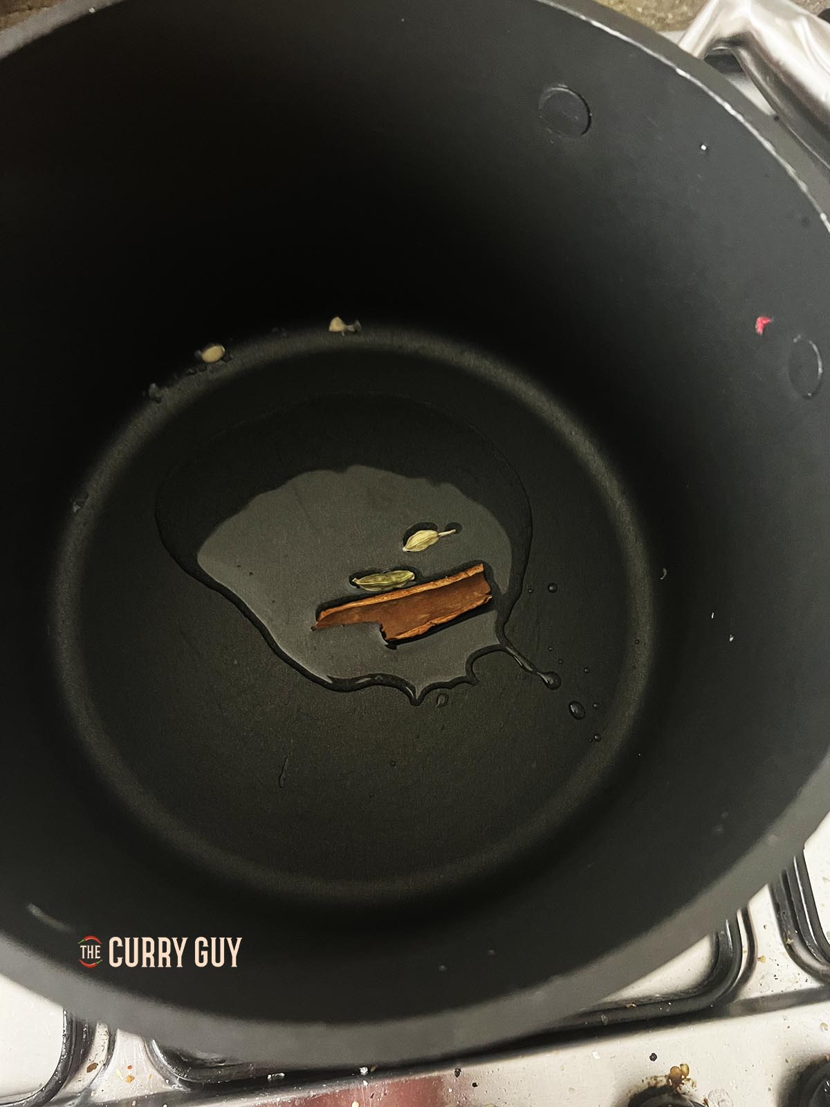 Infusing the whole spices in the oil.