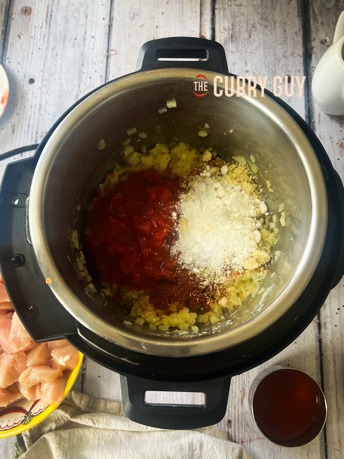 Tomatoes and spices added to the pan