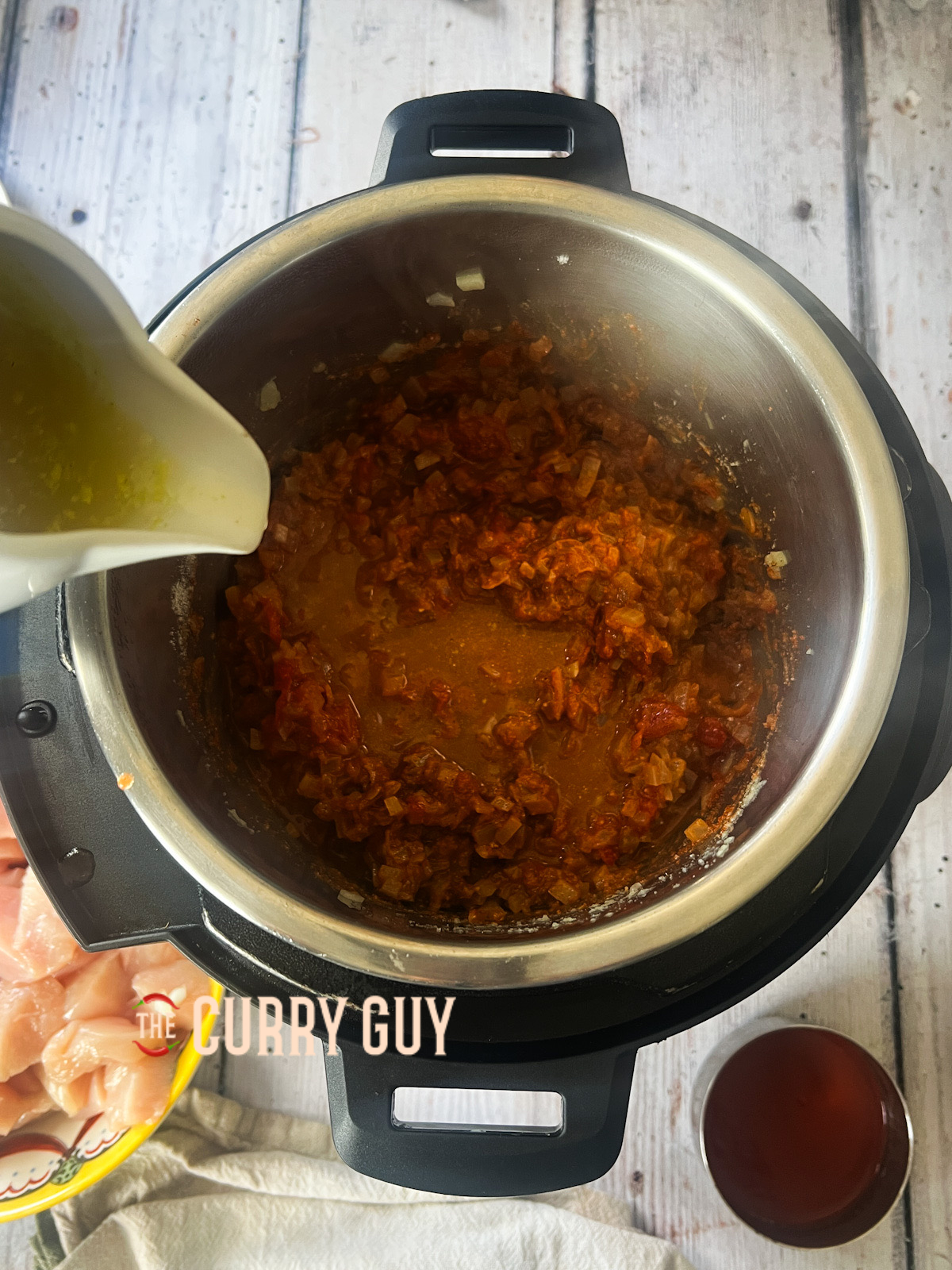 Chicken stock added to slow cooker.