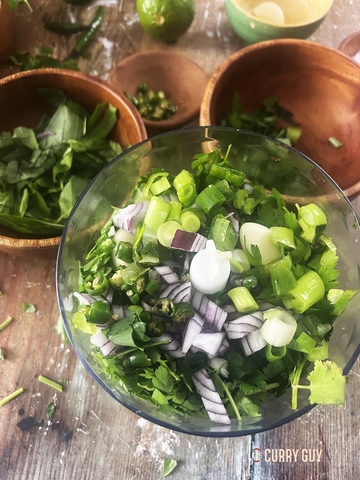 Half of the ingredients in a small food processor