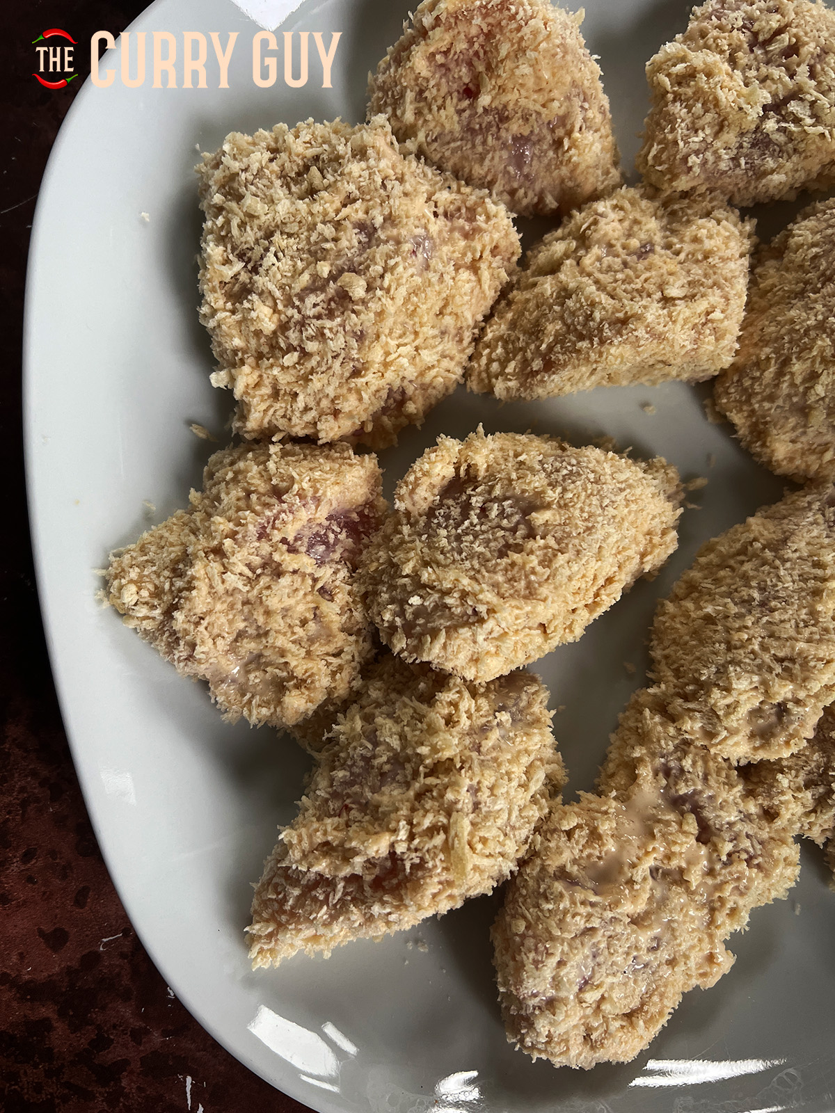 Evenly coated pieces of chicken breaded with panko breadcrumbs
