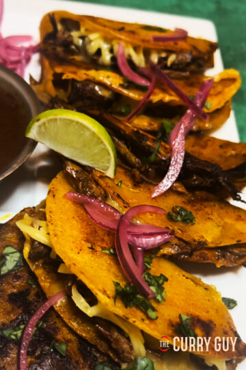 crock pot birria tacos on a plate