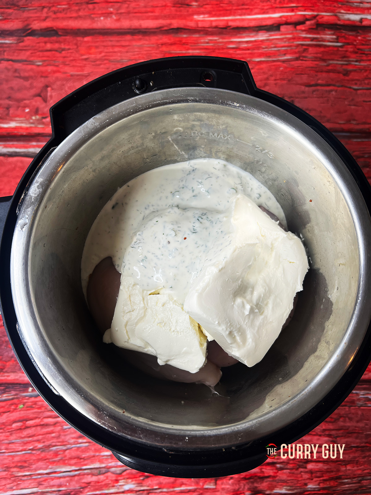Cream cheese and ranch dressing added to the crock pot