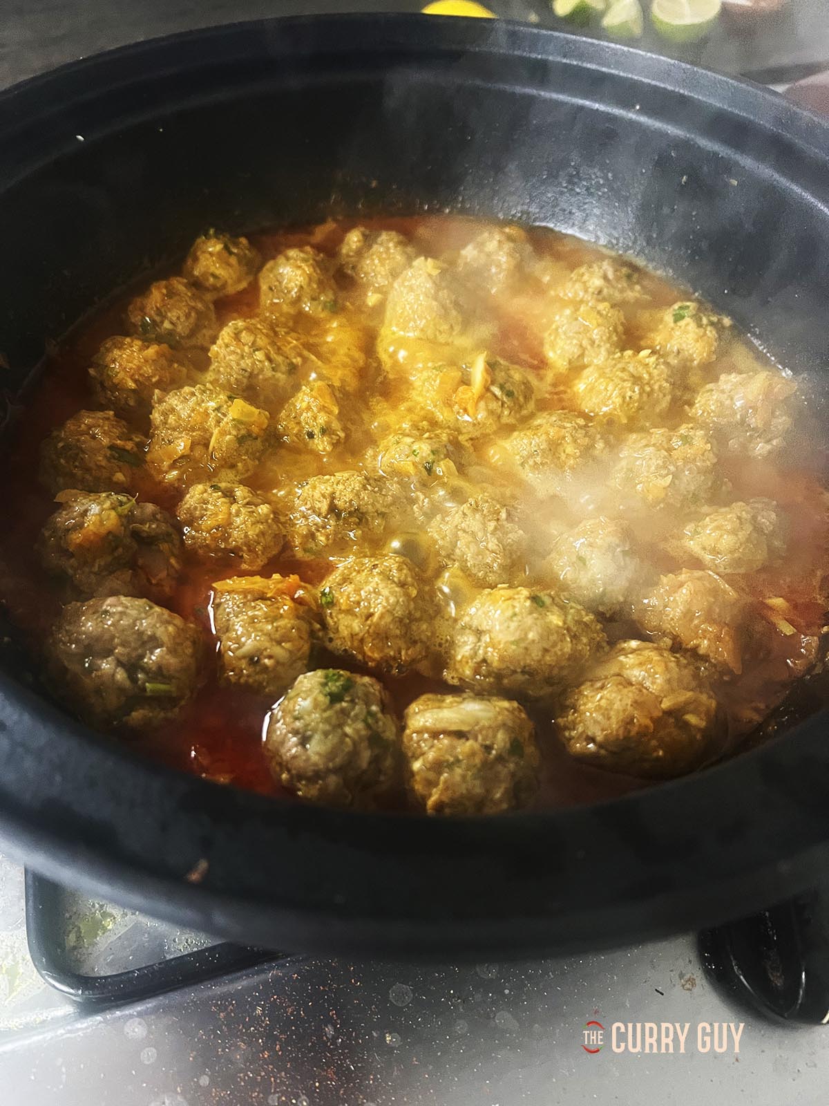 The meatballs after 10 minutes of simmering in the sauce.