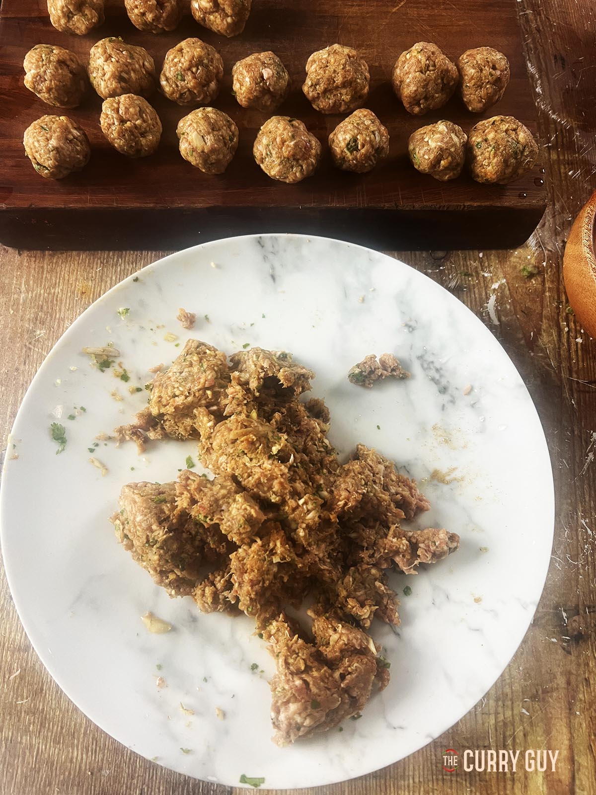 Forming the meat balls for the dish.