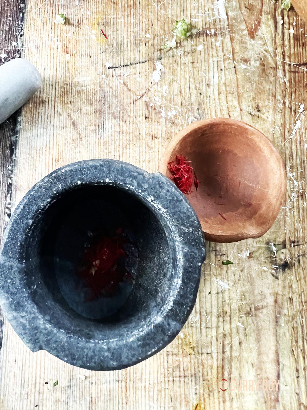 Preparing the saffron for the sauce.