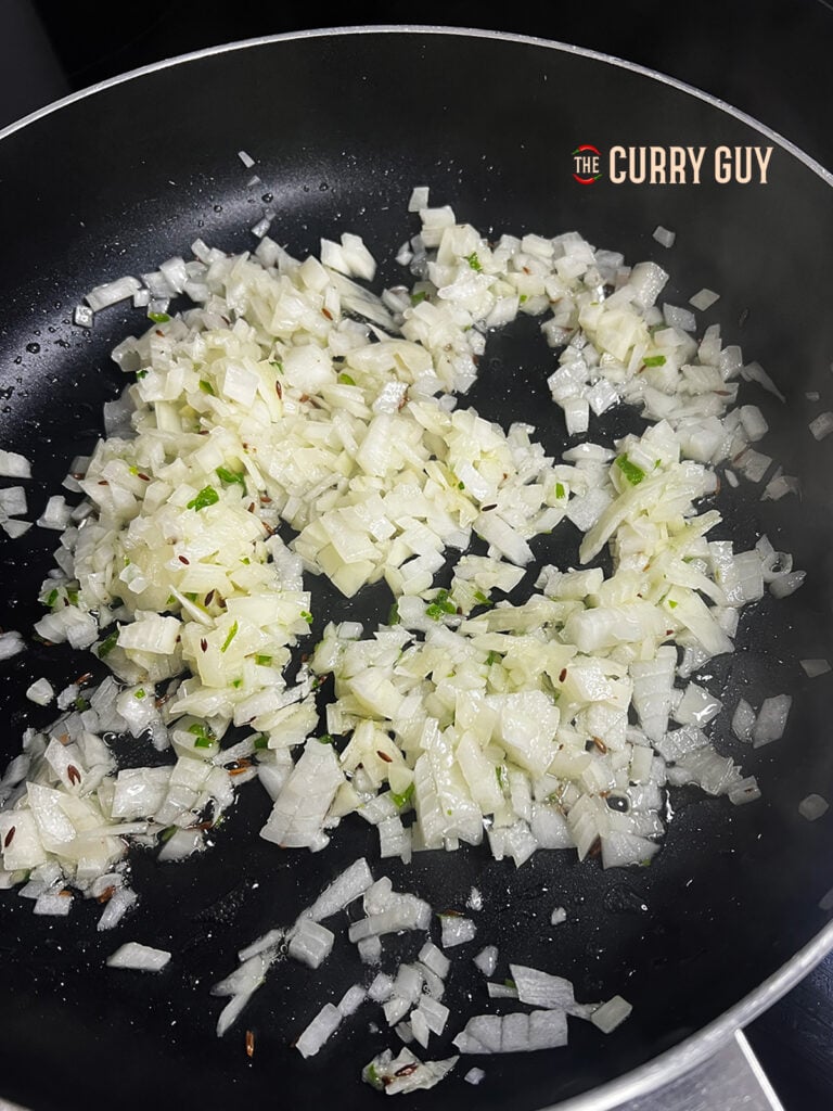 frying onions in a pan