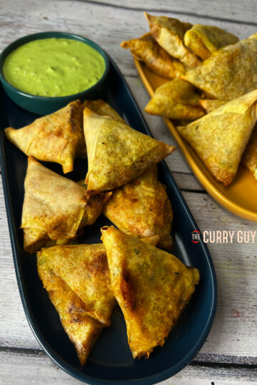 Air Fryer Samosa served on a plate with many other samosas
