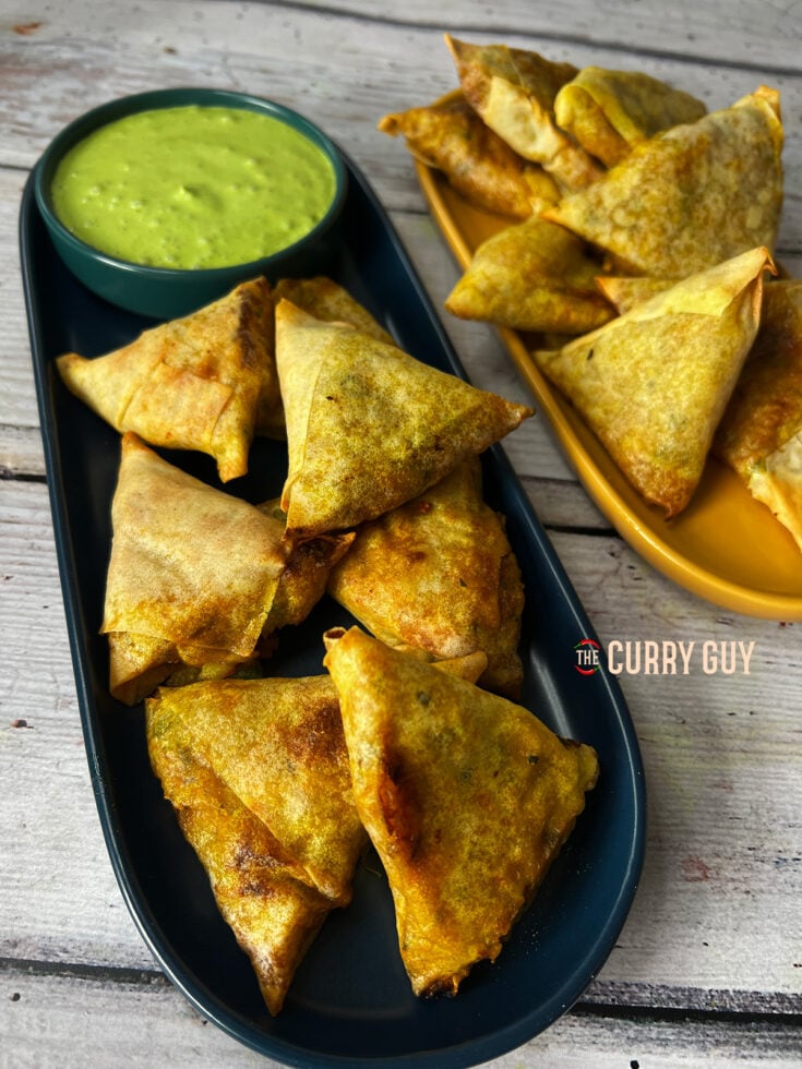 Air Fryer Samosa served on a plate with many other samosas
