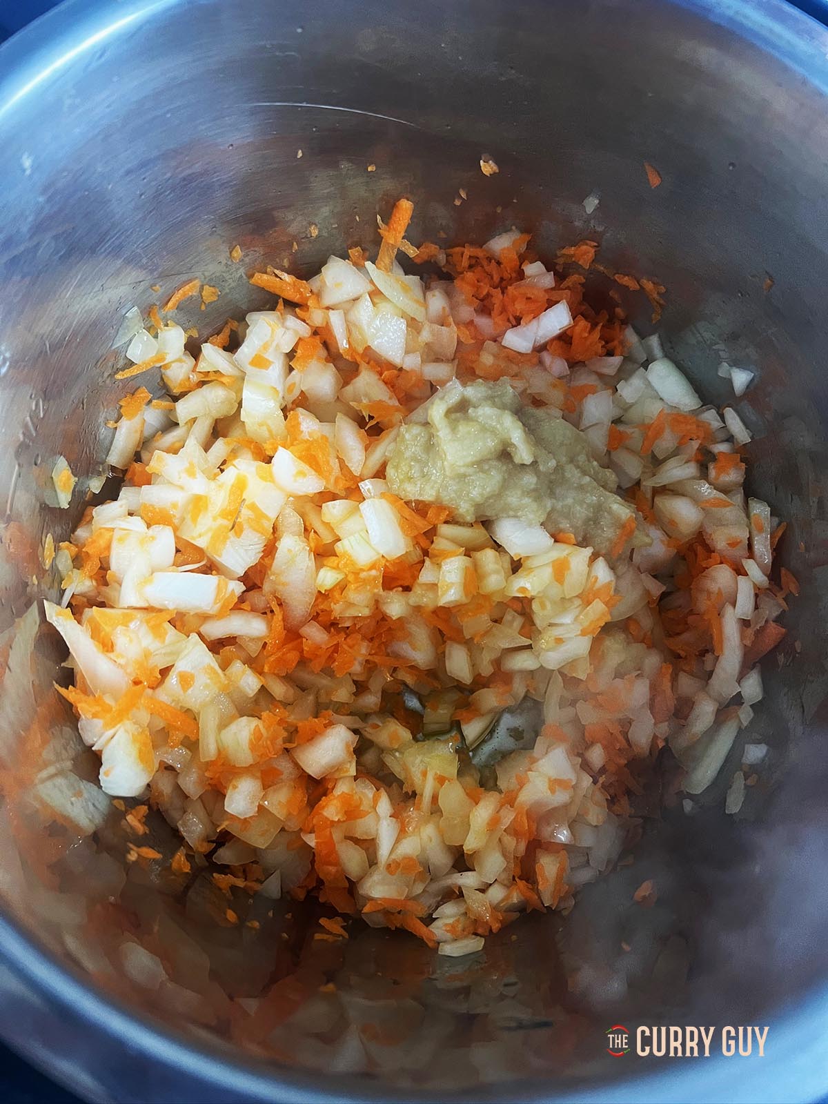 carrots and garlic added to the curry