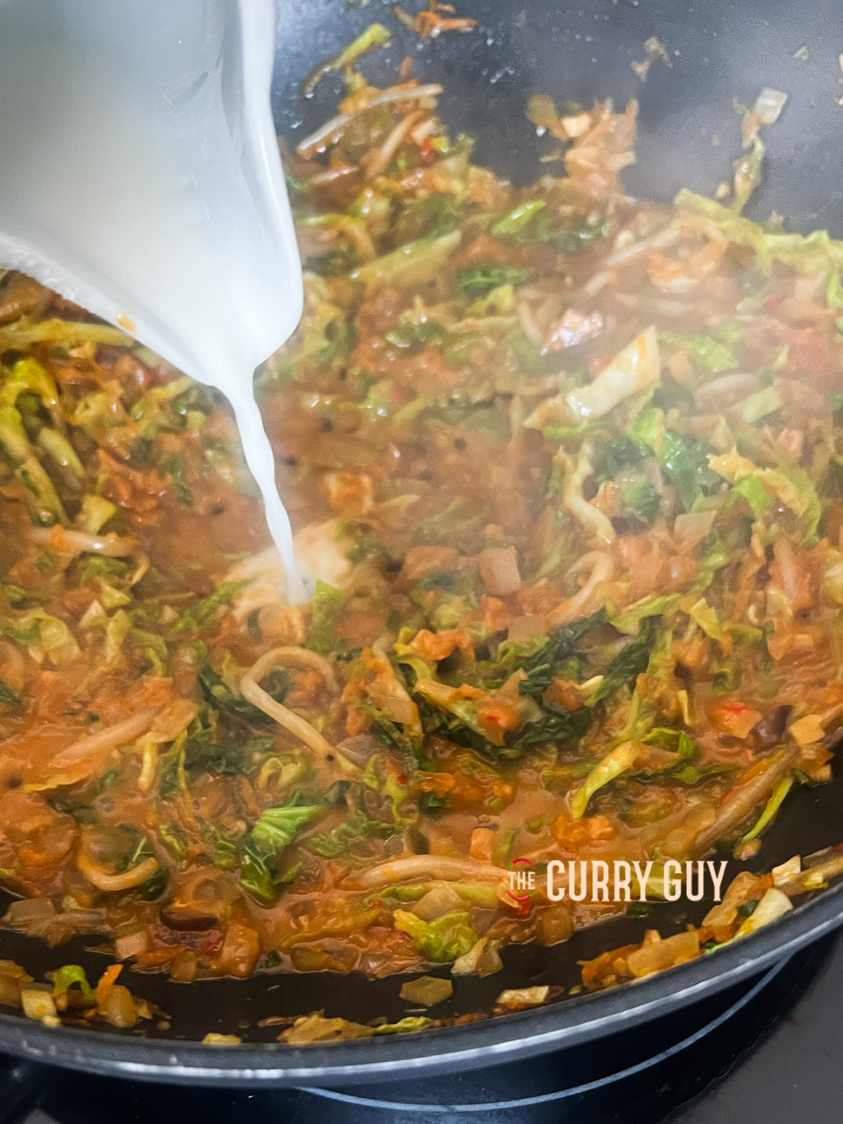 Thickening the sauce for the spring roll filling