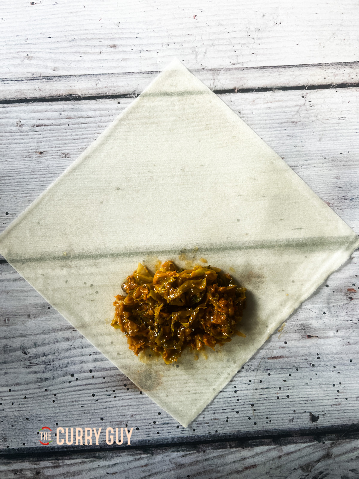 adding filling to spring roll wrapper