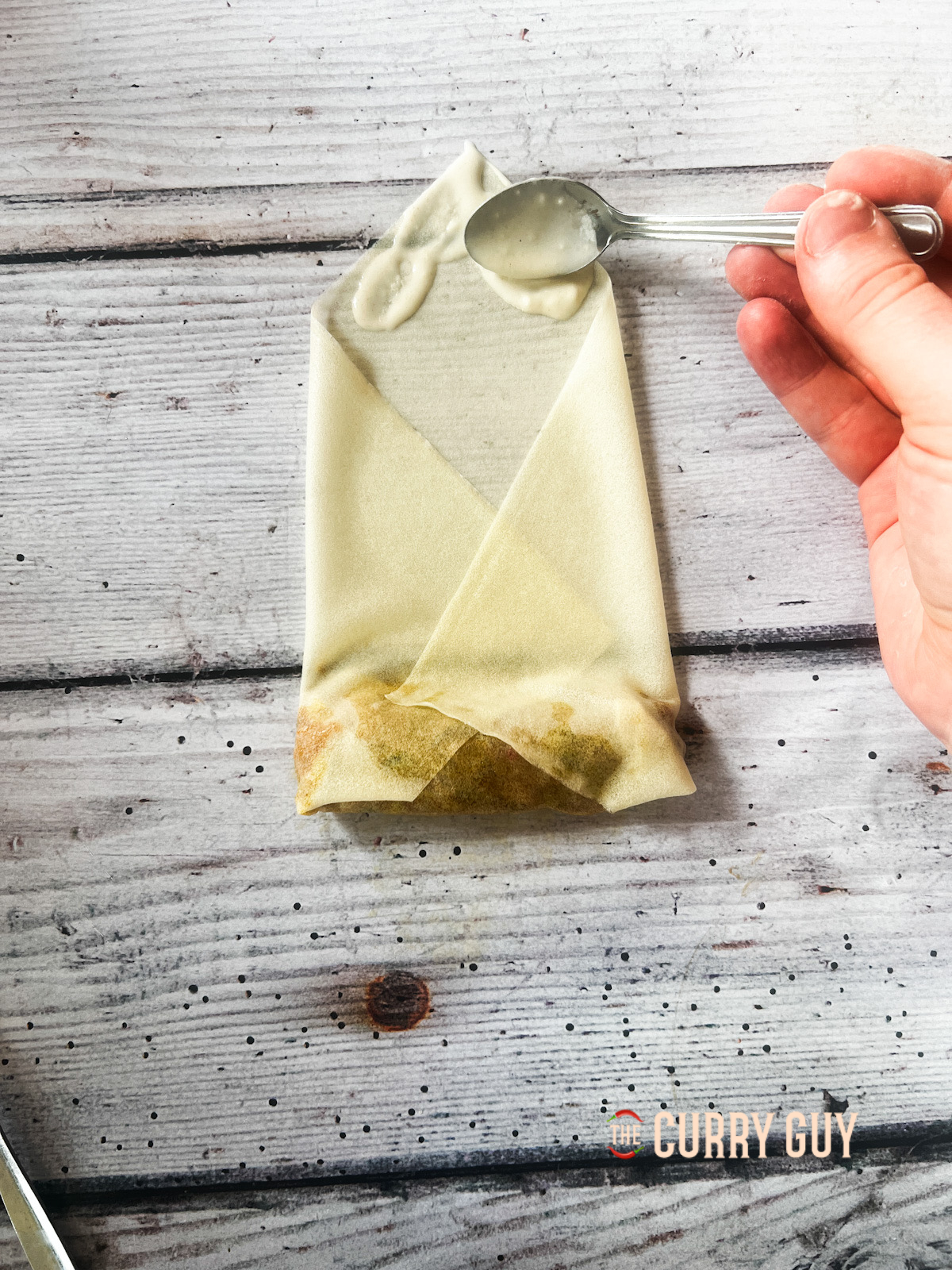 Folding and securing the spring roll