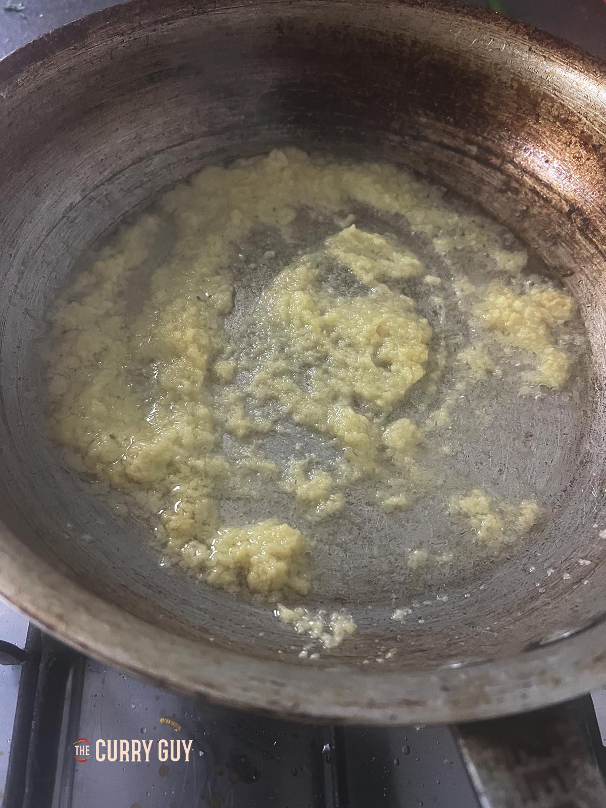 Frying the garlic and ginger paste.