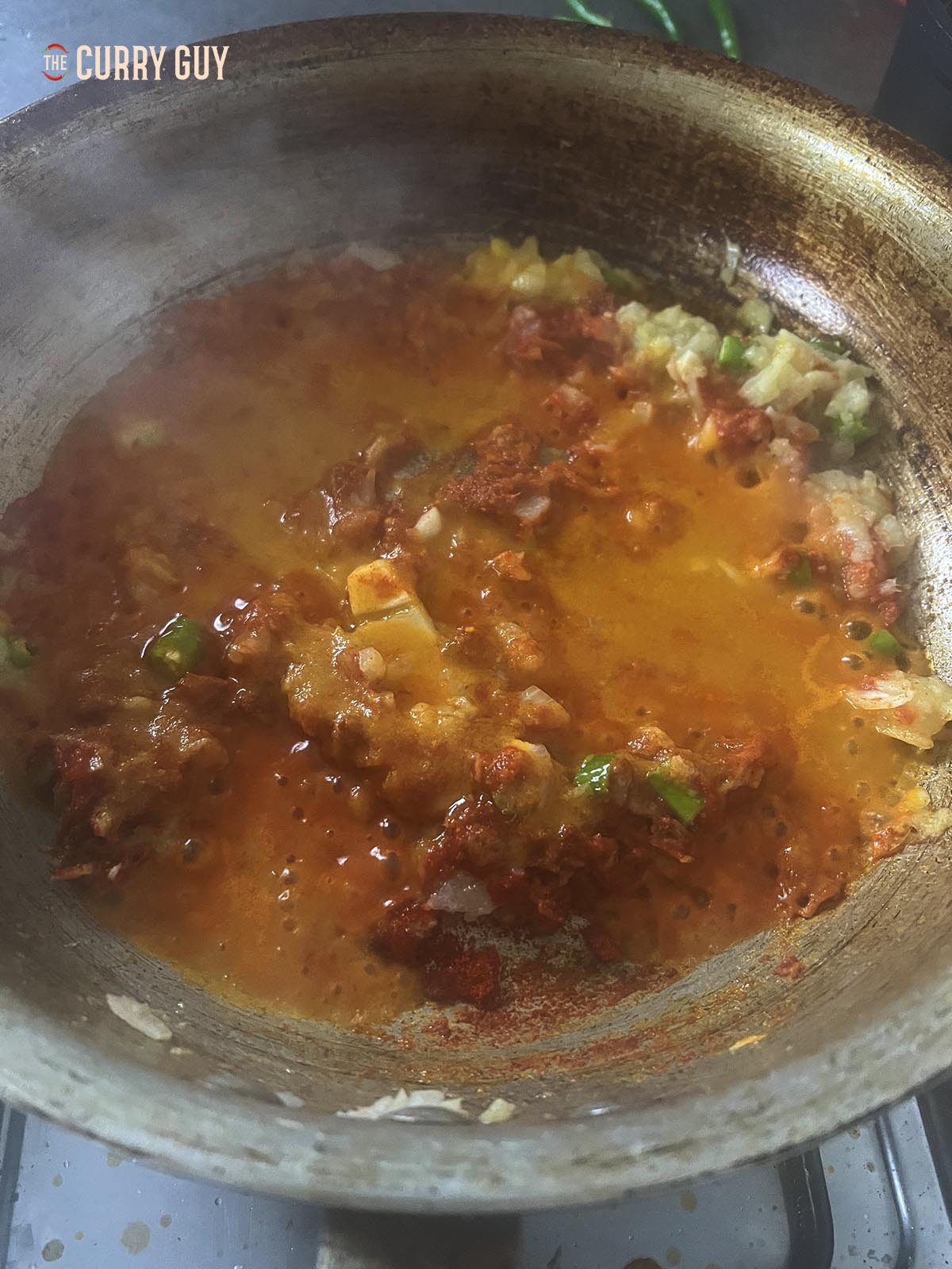 Adding about 70ml (1/4 cup) base curry sauce.