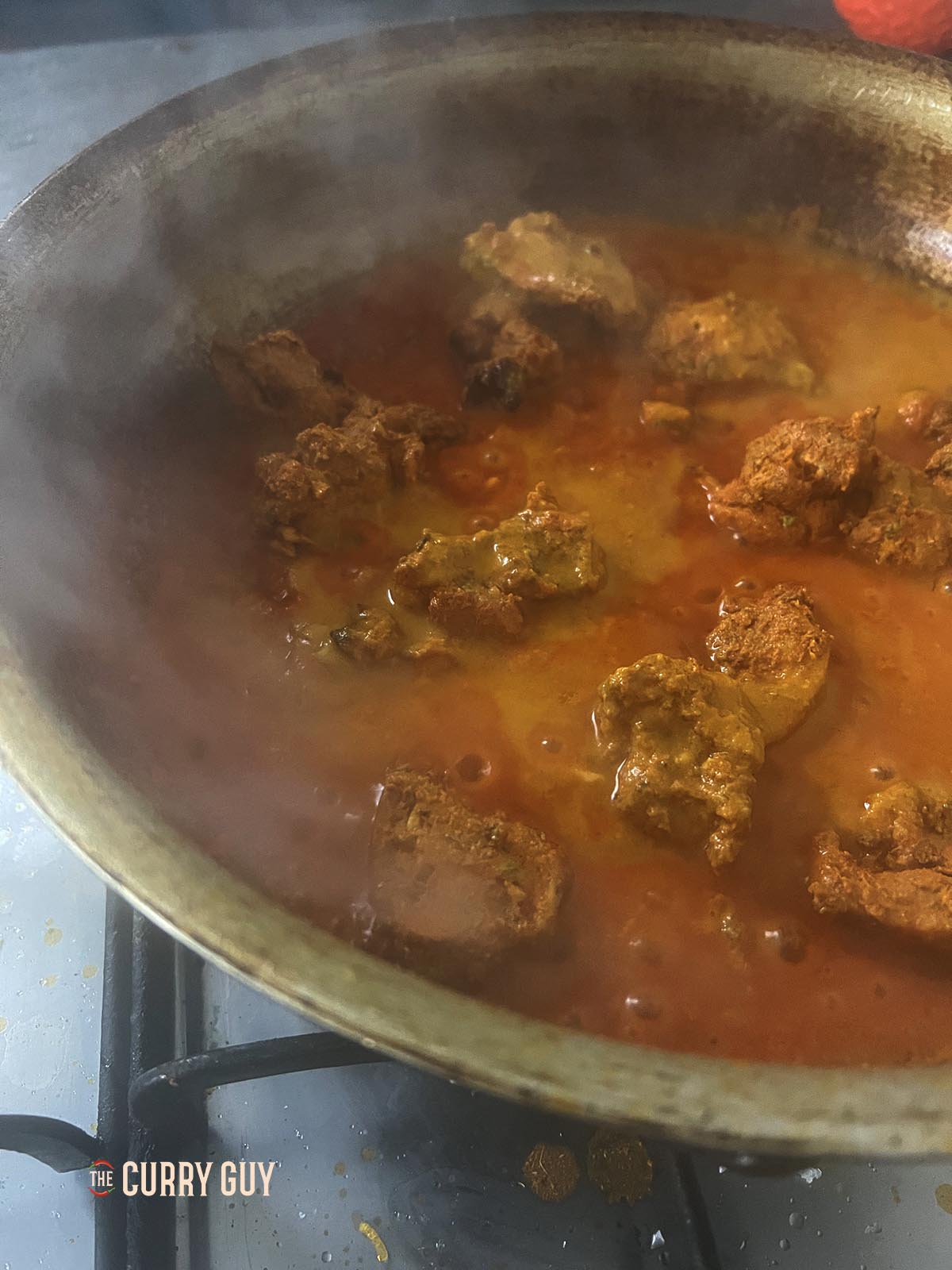 Stirring in the pre-cooked chicken.