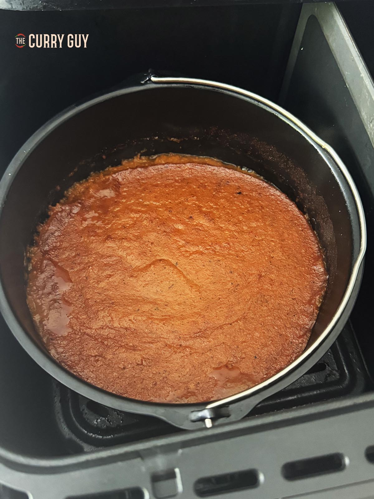 Air frying the sauce in a cake tin in the cooking basket.