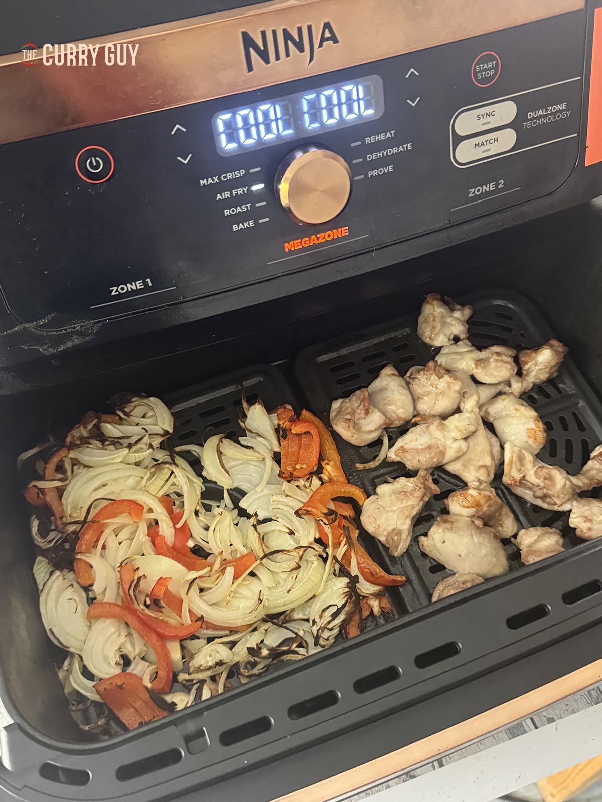 Air frying the onions and meat for the curry.