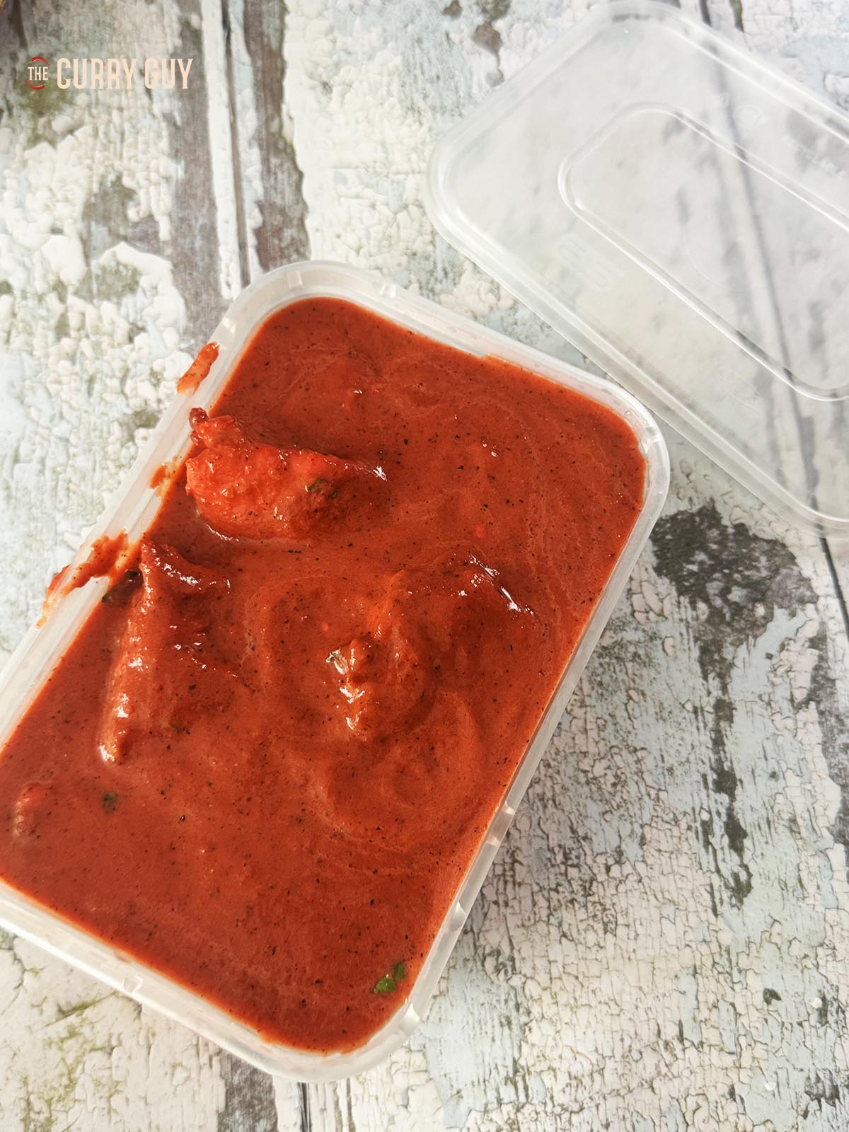 The chasni curry in a takeaway dish.