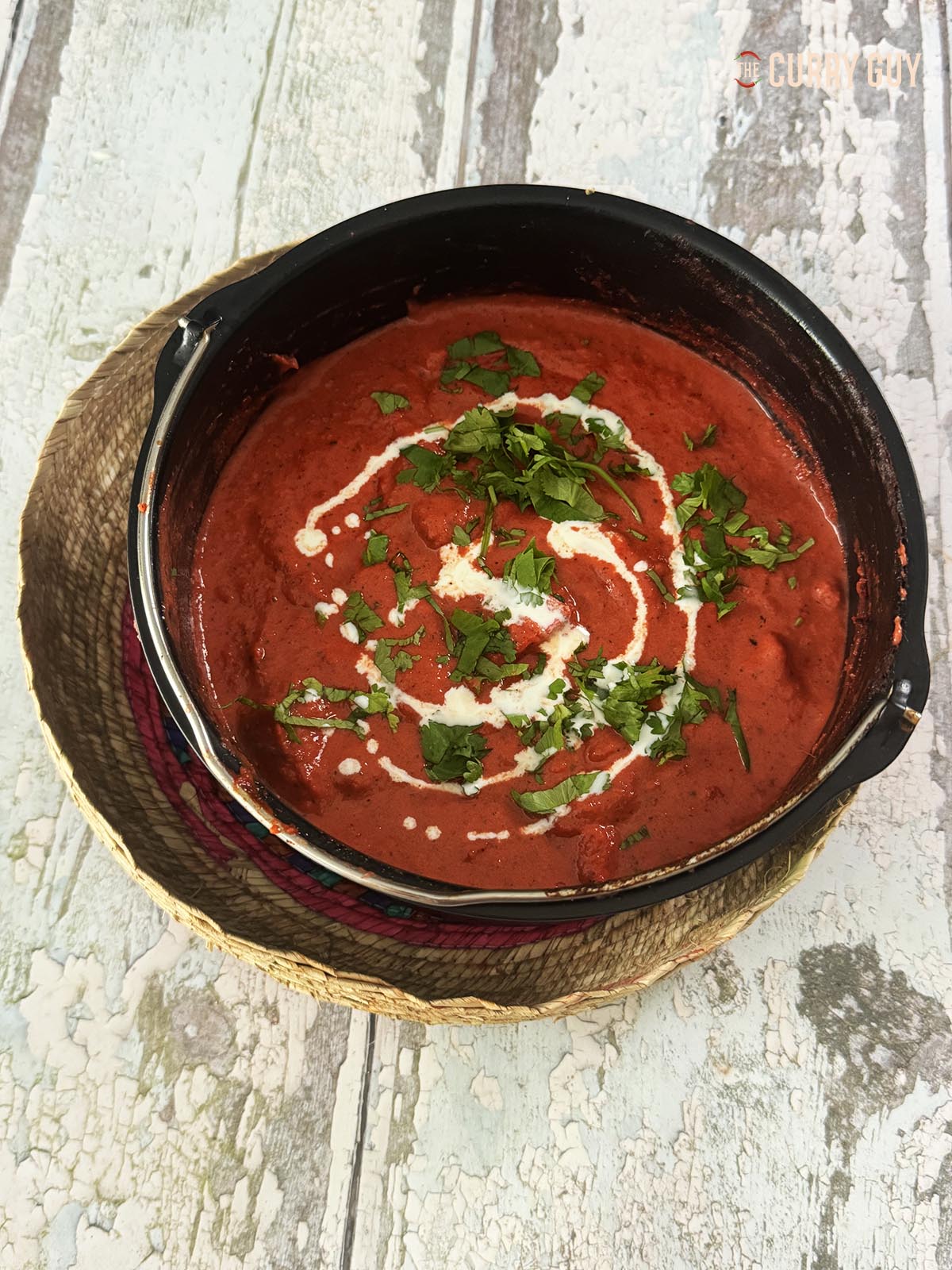 Air fryer chicken chasni, served at the table in the cooking tin.