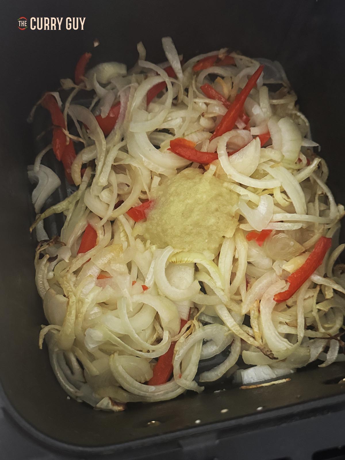 Air frying the onions, bell pepper and garlic and ginger paste.