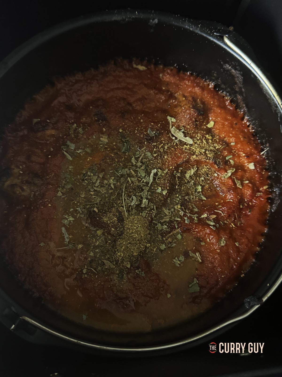 Adding the kasoori methi, garam masala and lemon juice to taste.