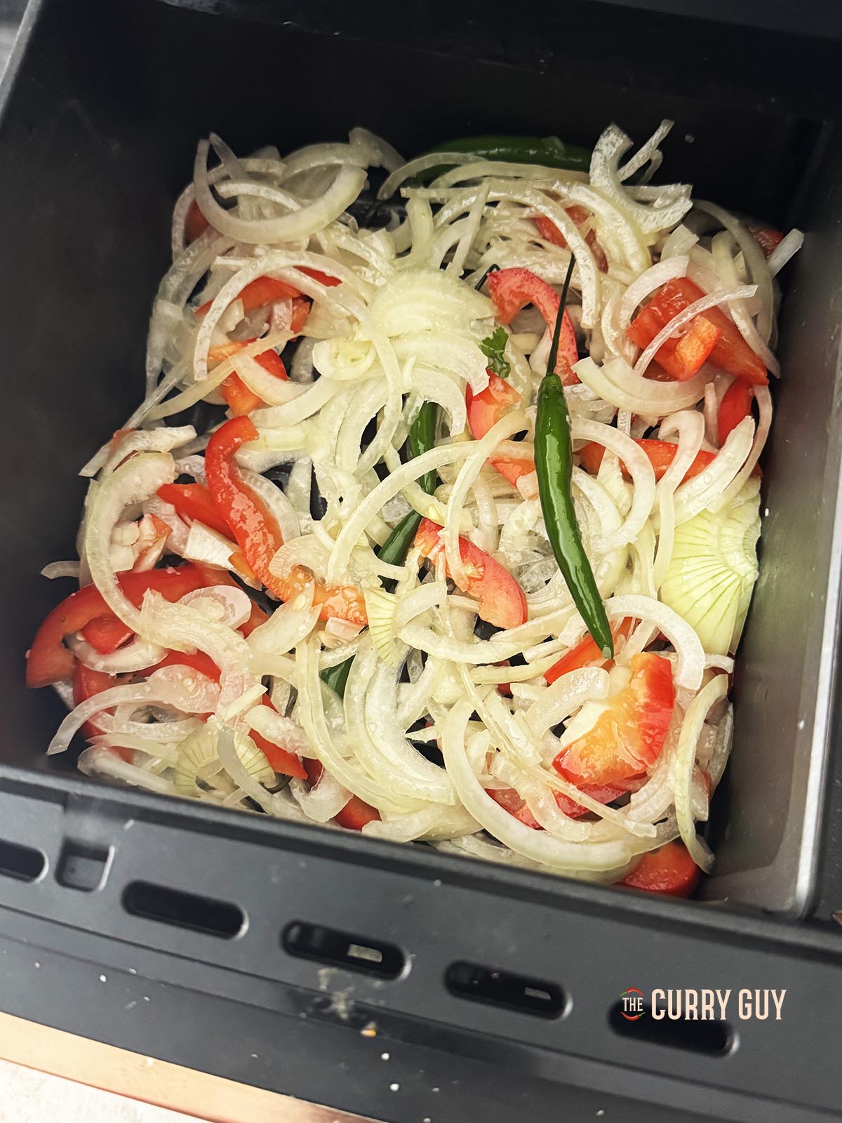 The onion mixture in the cooking basket.