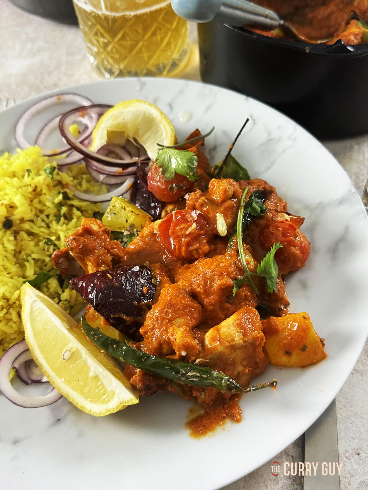 Air fryer chicken jalfrezi served on a plate at the table.