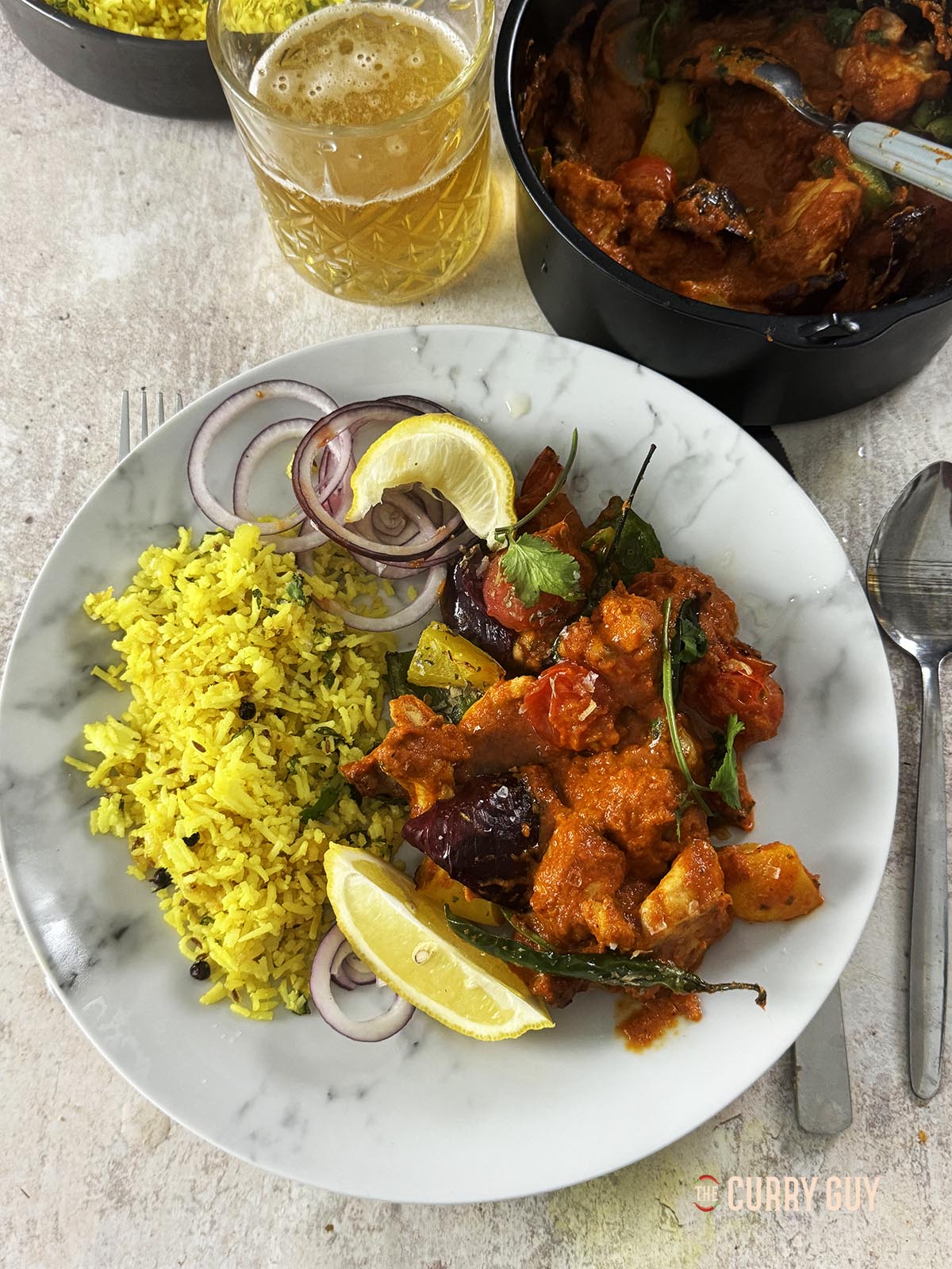 Air fryer chicken jalfrezi served on a plate with air fryer pilau rice.