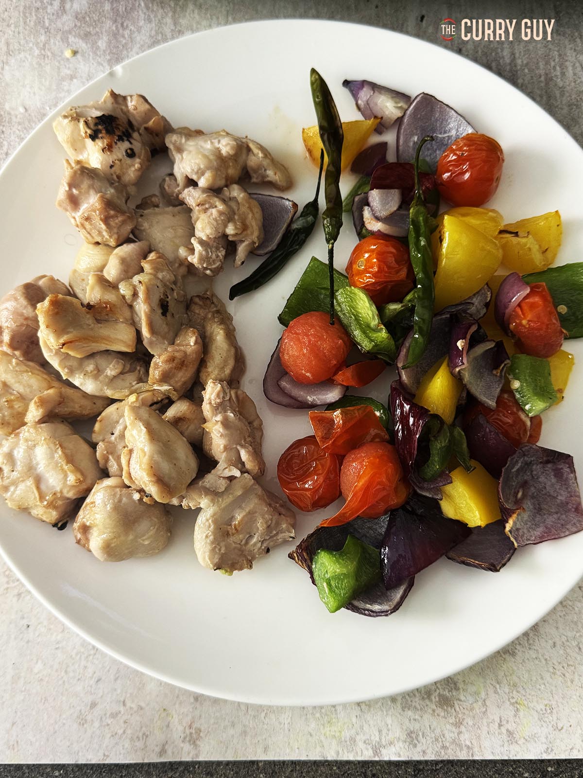 The cooked chicken and vegetables for the jalfrezi.