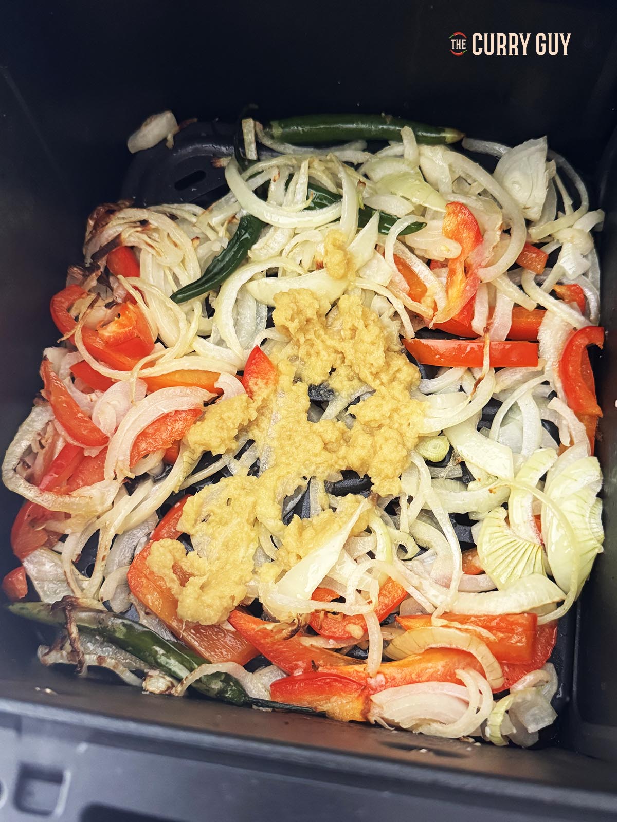 Adding the garlic and ginger paste.