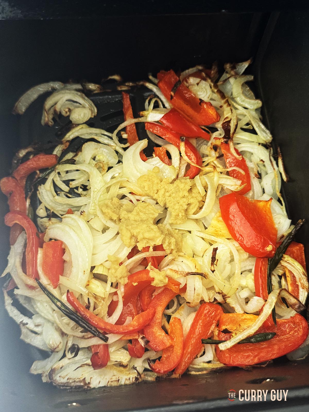 Air frying the onions, bell pepper and garlic and ginger paste.