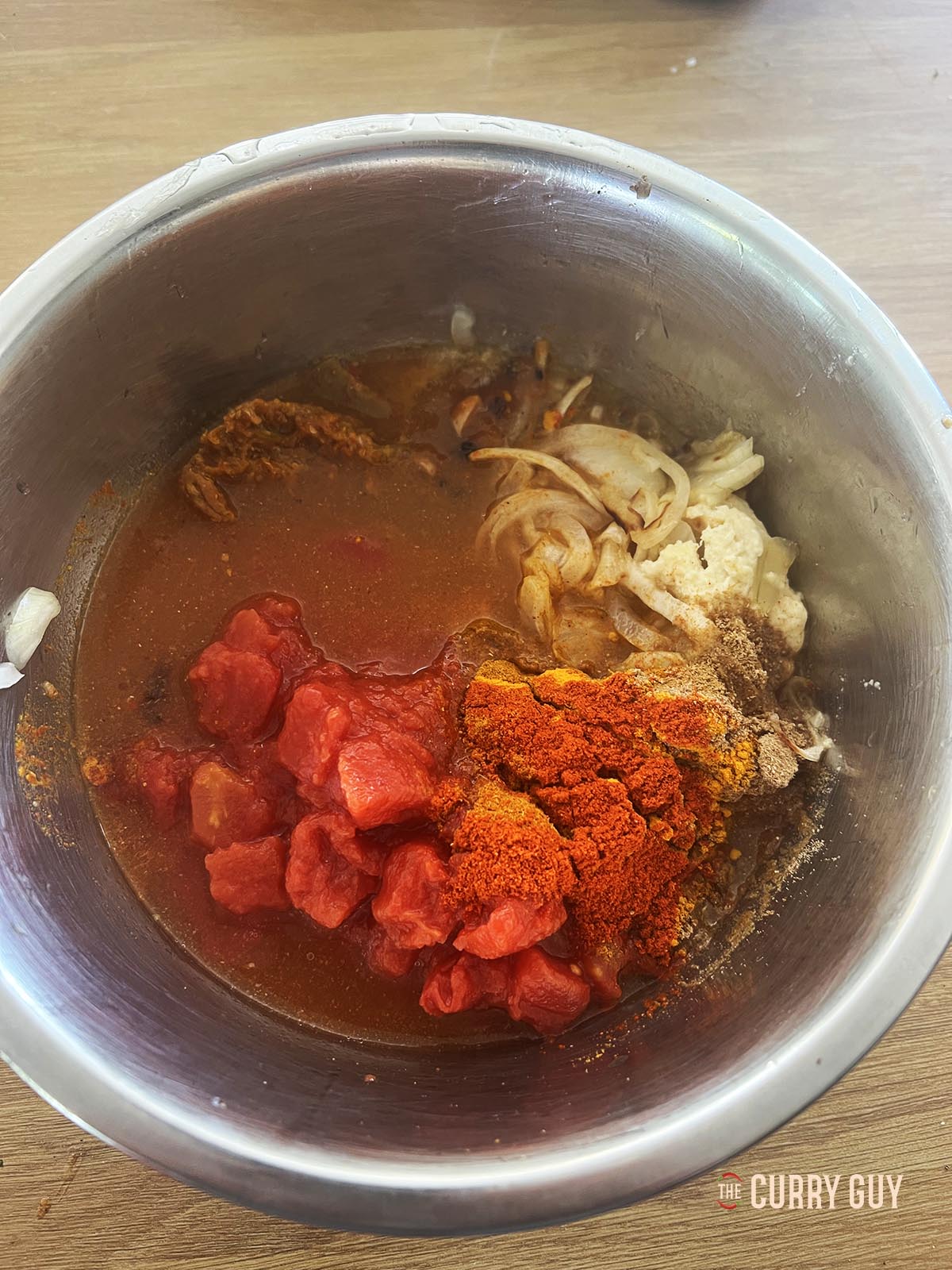 All of the sauce ingredients in a mixing bowl.