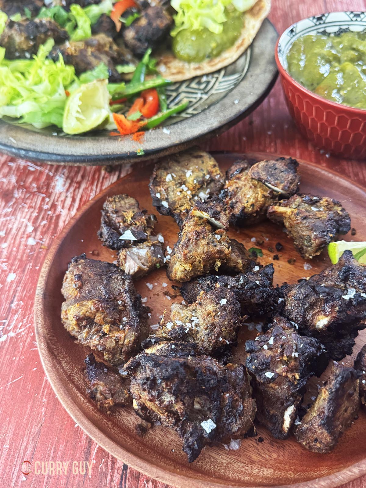 Lamb tikka on a serving plate.
