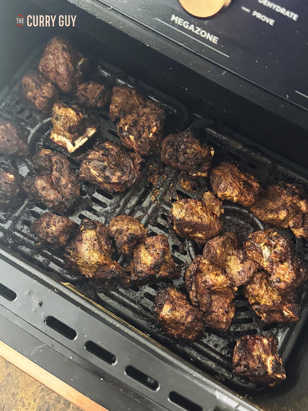The cooked lamb tikka in the air fryer.