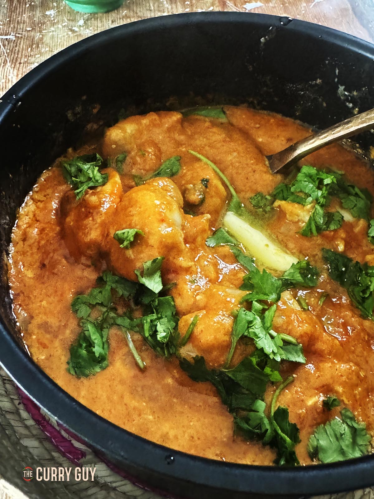 Air fried chicken rezala in the cake tin it was cooked in.